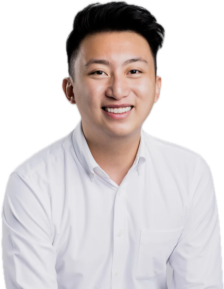 Joshua Ng Xuan, Singapore property agent, smiling in a white shirt